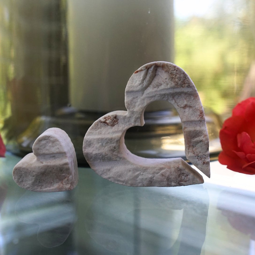 Jerusalem stone nesting hearts on table with flowers