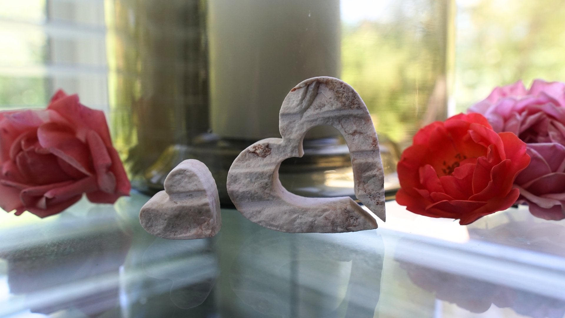 Jerusalem stone nesting hearts on table with flowers